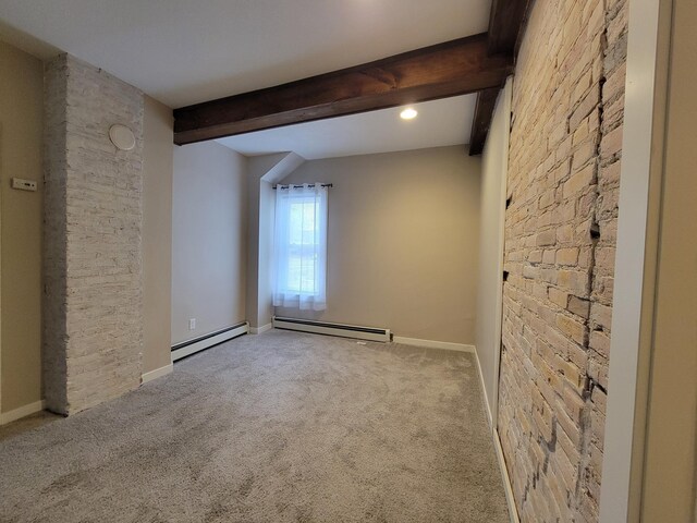 spare room with beamed ceiling, light carpet, and a baseboard heating unit