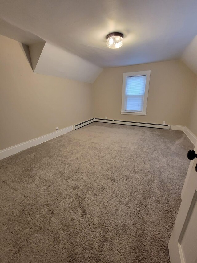 bonus room featuring lofted ceiling and carpet floors