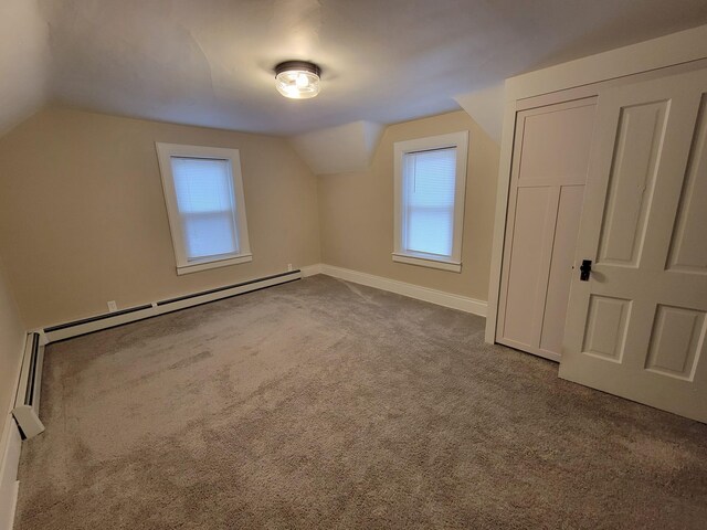 bonus room with lofted ceiling, carpet floors, and a baseboard radiator