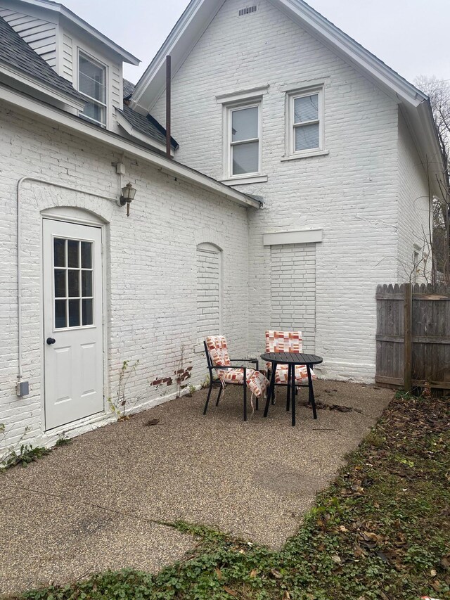 back of property with a patio area