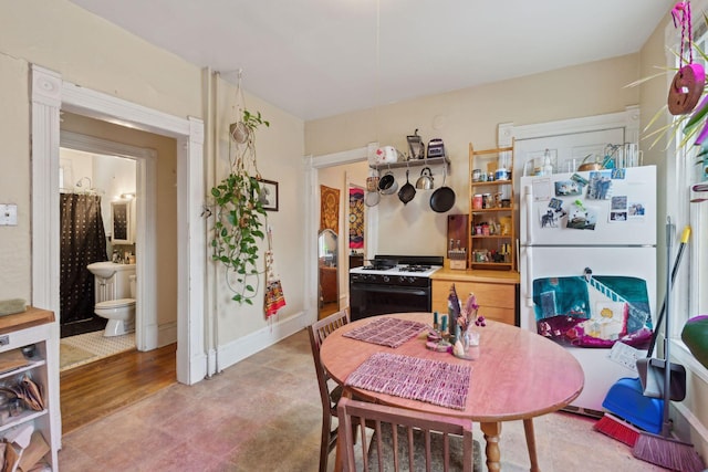 kitchen featuring white refrigerator and gas stove