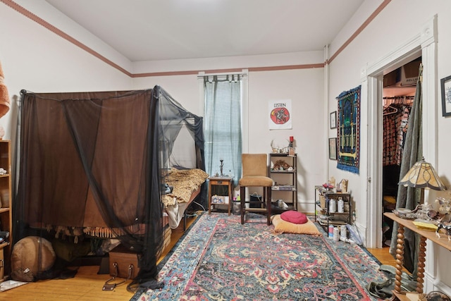 bedroom with hardwood / wood-style floors