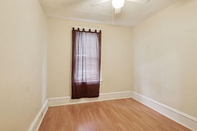 unfurnished room with wood-type flooring, a textured ceiling, and ceiling fan