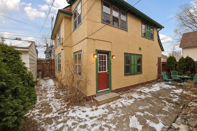 view of snow covered house