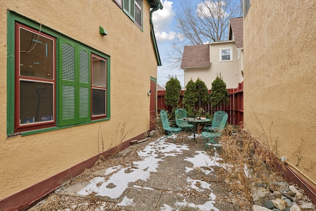 view of property exterior featuring a patio area