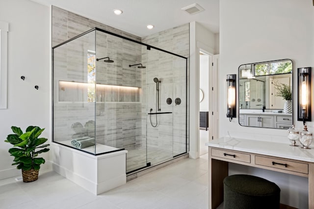 bathroom featuring vanity and an enclosed shower