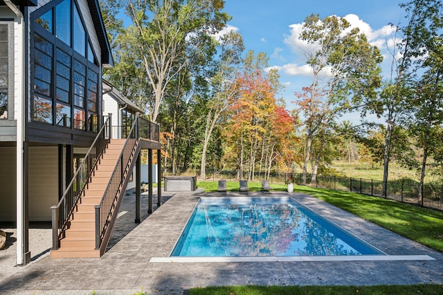 view of pool with a yard and a patio area