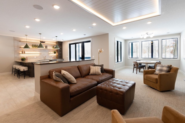 living room with plenty of natural light and indoor bar