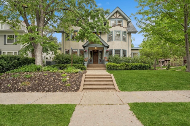 1941 James Ave S, Minneapolis, MN 55403 - view of front of property with stucco siding and a front yard