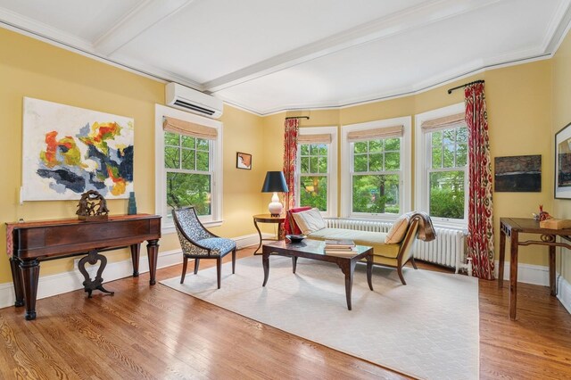 1941 James Ave S, Minneapolis, MN 55403 - sitting room with radiator, a wall mounted air conditioner, wood finished floors, baseboards, and beamed ceiling