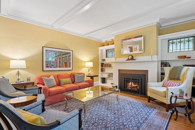 1941 James Ave S, Minneapolis, MN 55403 - living area with wood finished floors, crown molding, a lit fireplace, and built in shelves