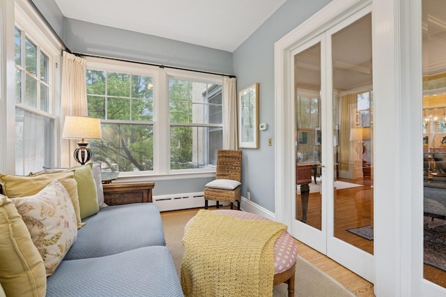 1941 James Ave S, Minneapolis, MN 55403 - sunroom / solarium with a baseboard radiator, wood finished floors, baseboards, and french doors