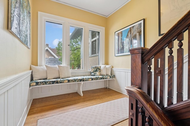 1941 James Ave S, Minneapolis, MN 55403 - entrance foyer featuring wood finished floors, a wainscoted wall, a decorative wall, crown molding, and stairs