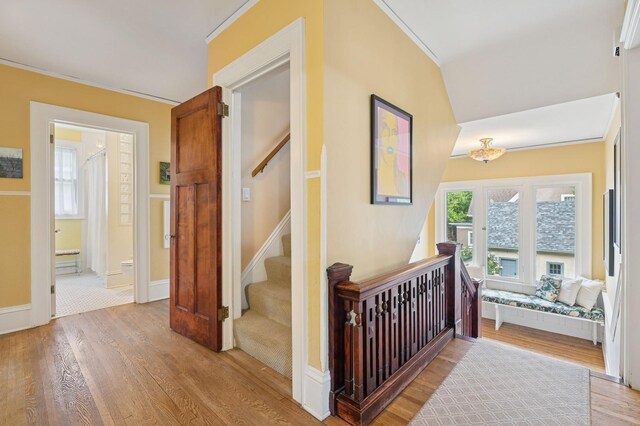 1941 James Ave S, Minneapolis, MN 55403 - corridor featuring light wood-style floors, ornamental molding, stairway, and baseboards