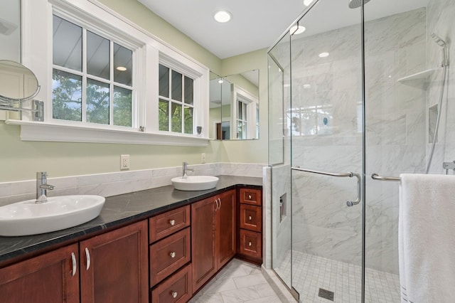 1941 James Ave S, Minneapolis, MN 55403 - full bath featuring marble finish floors, double vanity, and a stall shower