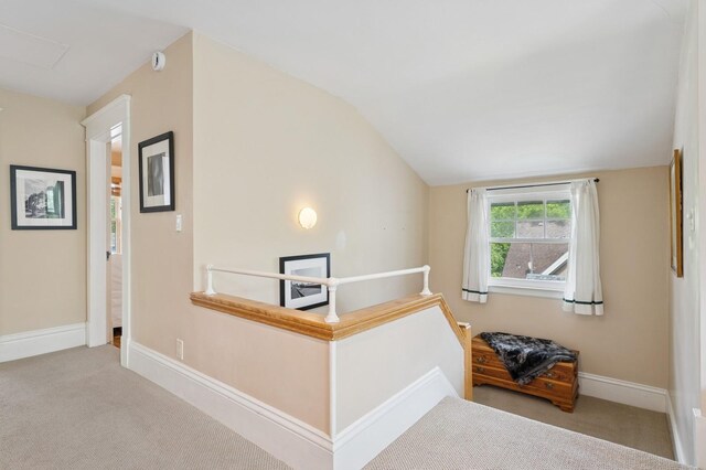 1941 James Ave S, Minneapolis, MN 55403 - hall featuring carpet, vaulted ceiling, and baseboards