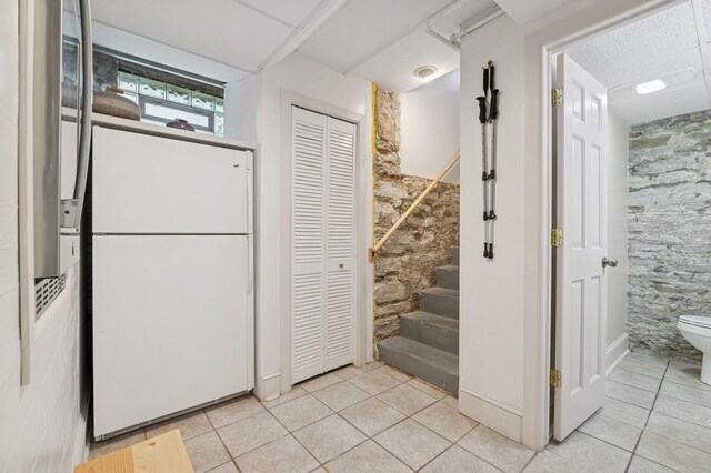 1941 James Ave S, Minneapolis, MN 55403 - kitchen featuring freestanding refrigerator and light tile patterned floors