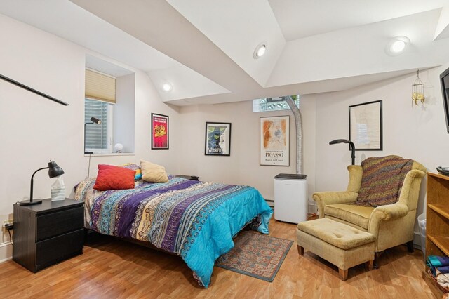 1941 James Ave S, Minneapolis, MN 55403 - bedroom featuring wood finished floors and vaulted ceiling