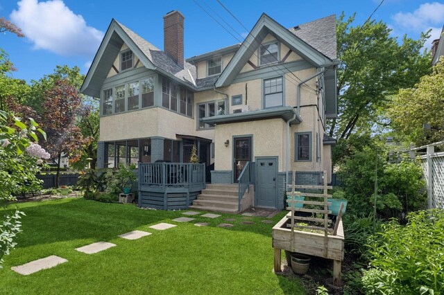 1941 James Ave S, Minneapolis, MN 55403 - back of property with a wooden deck, stucco siding, and a chimney