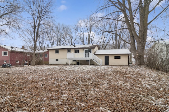 view of snow covered rear of property