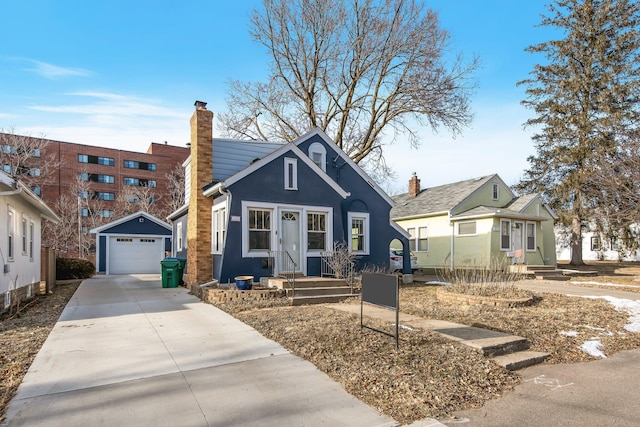 view of front of house featuring an outbuilding and a garage