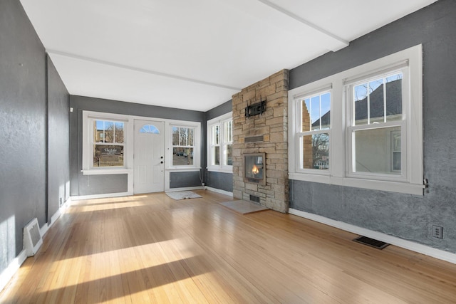 unfurnished living room featuring light hardwood / wood-style floors