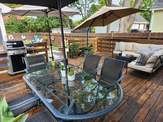 deck with outdoor lounge area and a grill