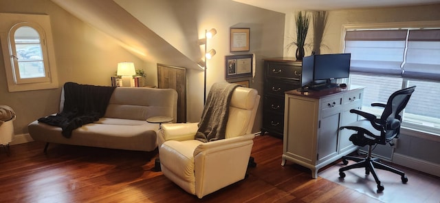 home office featuring dark wood-type flooring and lofted ceiling