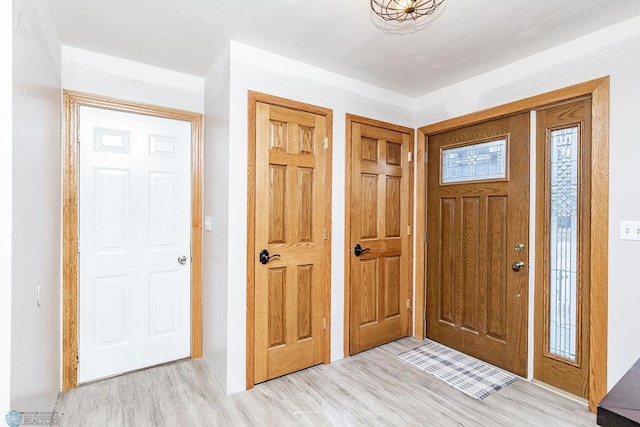 foyer featuring light wood-style flooring