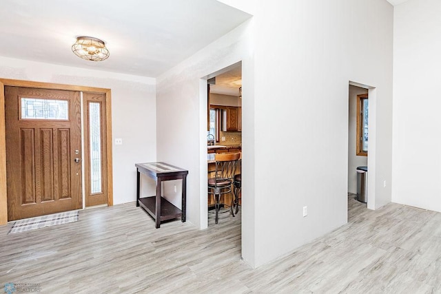 foyer featuring wood finished floors