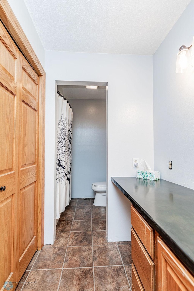 full bath with vanity and toilet