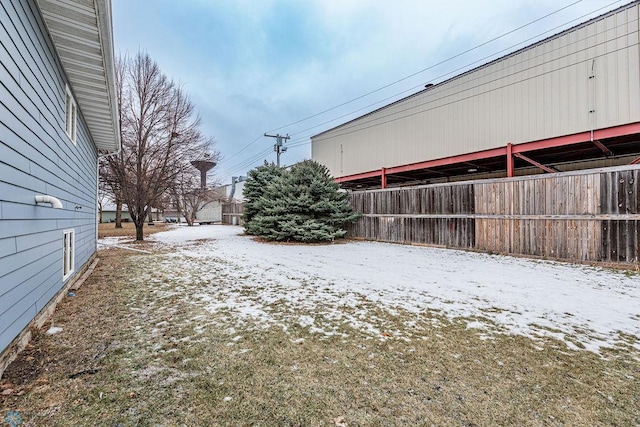 view of yard layered in snow