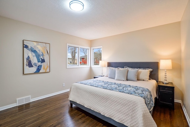 bedroom featuring dark hardwood / wood-style flooring