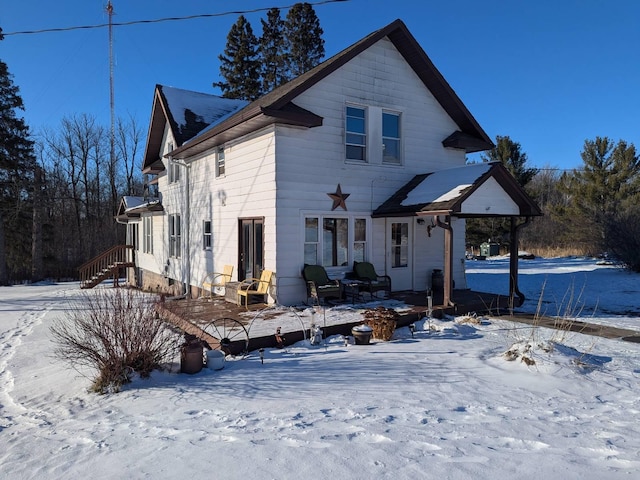 view of snow covered house