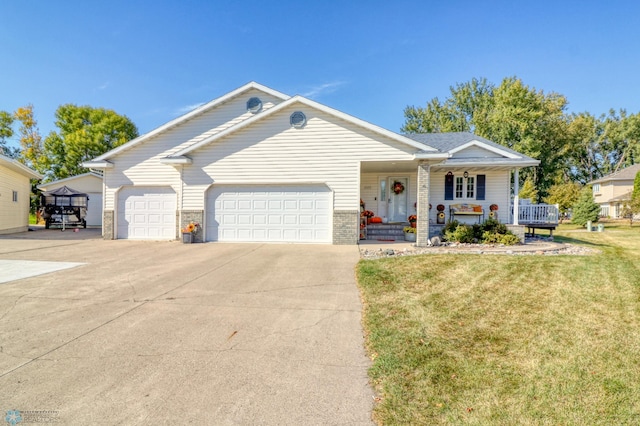 ranch-style home featuring a front yard, a porch, and a garage