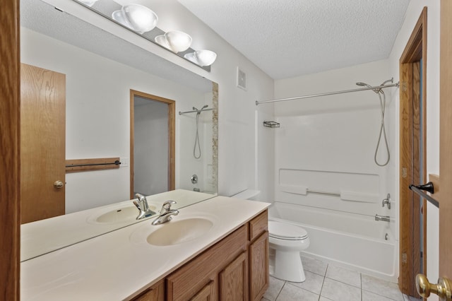 full bathroom with tile patterned floors, vanity, a textured ceiling, washtub / shower combination, and toilet