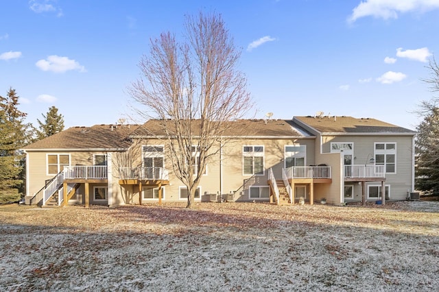 rear view of house featuring a deck and central AC unit