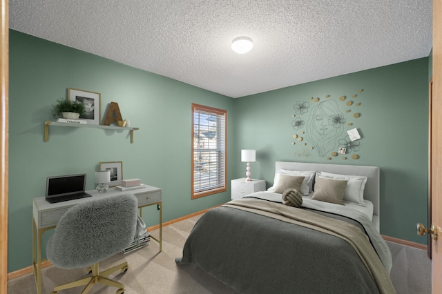 carpeted bedroom with a textured ceiling