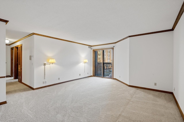 carpeted empty room with crown molding