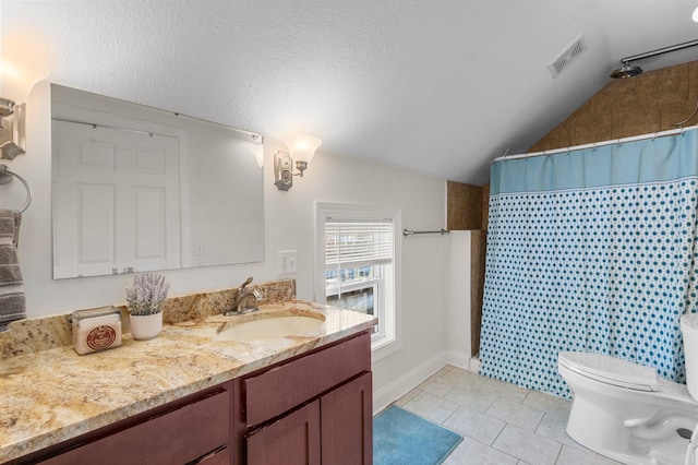 bathroom featuring a textured ceiling, tile patterned flooring, toilet, vanity, and visible vents