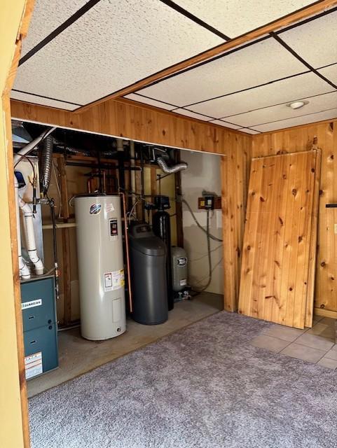 utility room featuring water heater