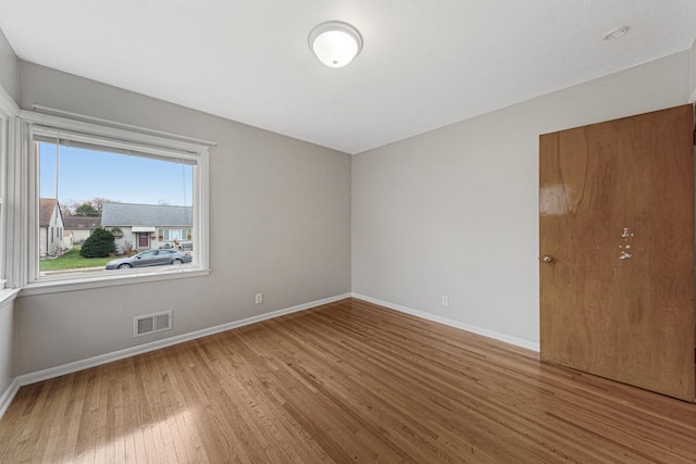 spare room featuring hardwood / wood-style flooring