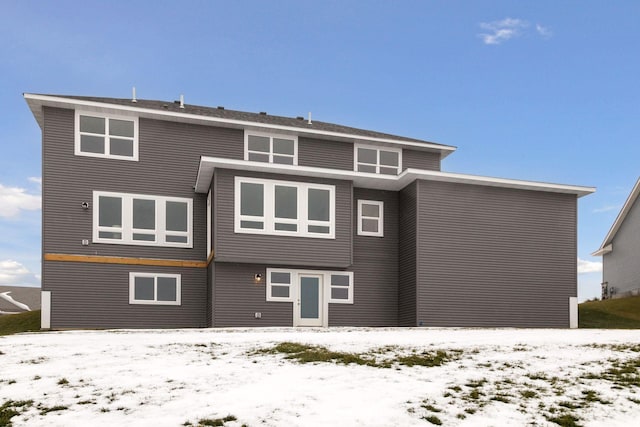 view of snow covered house