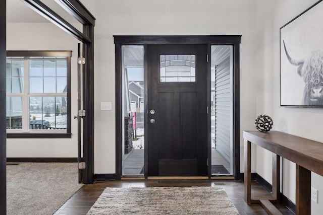 foyer entrance featuring dark hardwood / wood-style floors