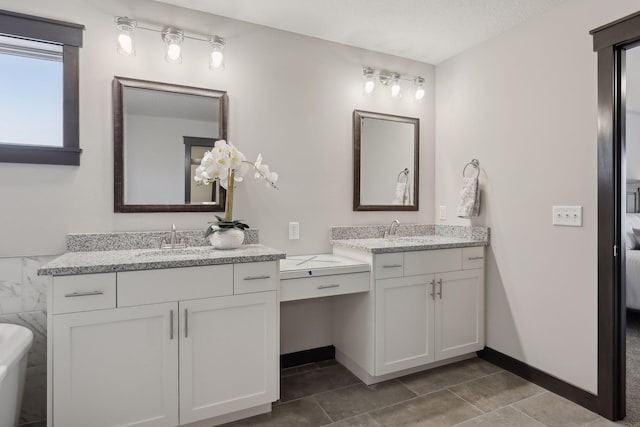 bathroom featuring vanity and a textured ceiling