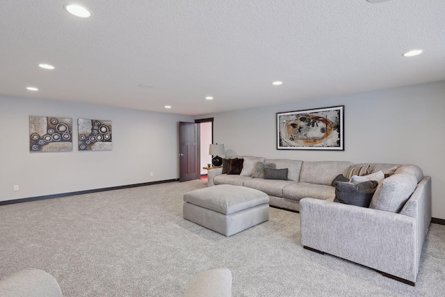 living room featuring light colored carpet and a textured ceiling