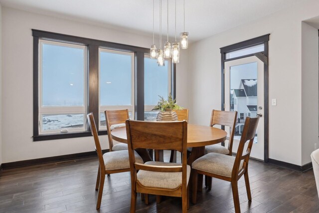 dining room with dark wood-style floors and baseboards