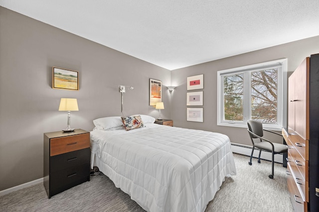 bedroom featuring a baseboard radiator, light colored carpet, and a textured ceiling