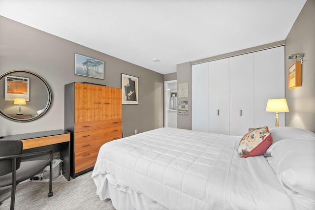 carpeted bedroom featuring a closet