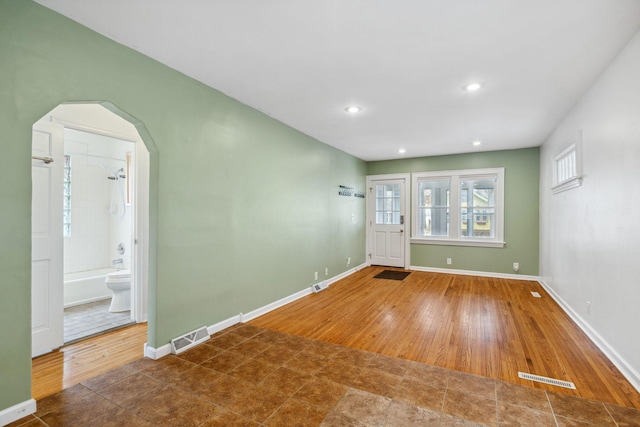 unfurnished room with dark hardwood / wood-style floors